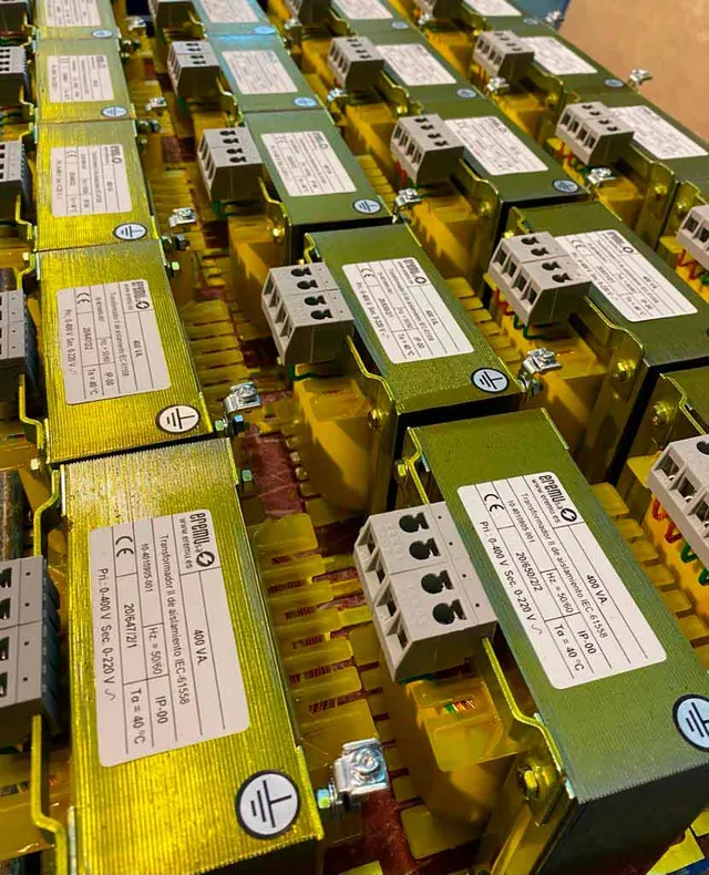 EREMU isolation transformers lined up in the workshop, with their rating plates already fitted.